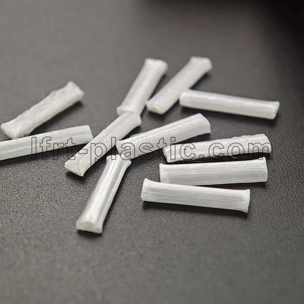 A close-up photograph of high-quality, uniformly cut LFT pellets. A close-up photograph of high-quality, uniformly cut LFT pellets.
